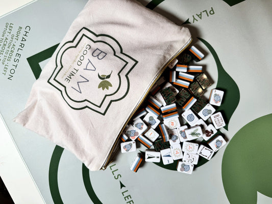 In Season mahjong tiles spilling from the Bam Good Time canvas bag onto the green mat