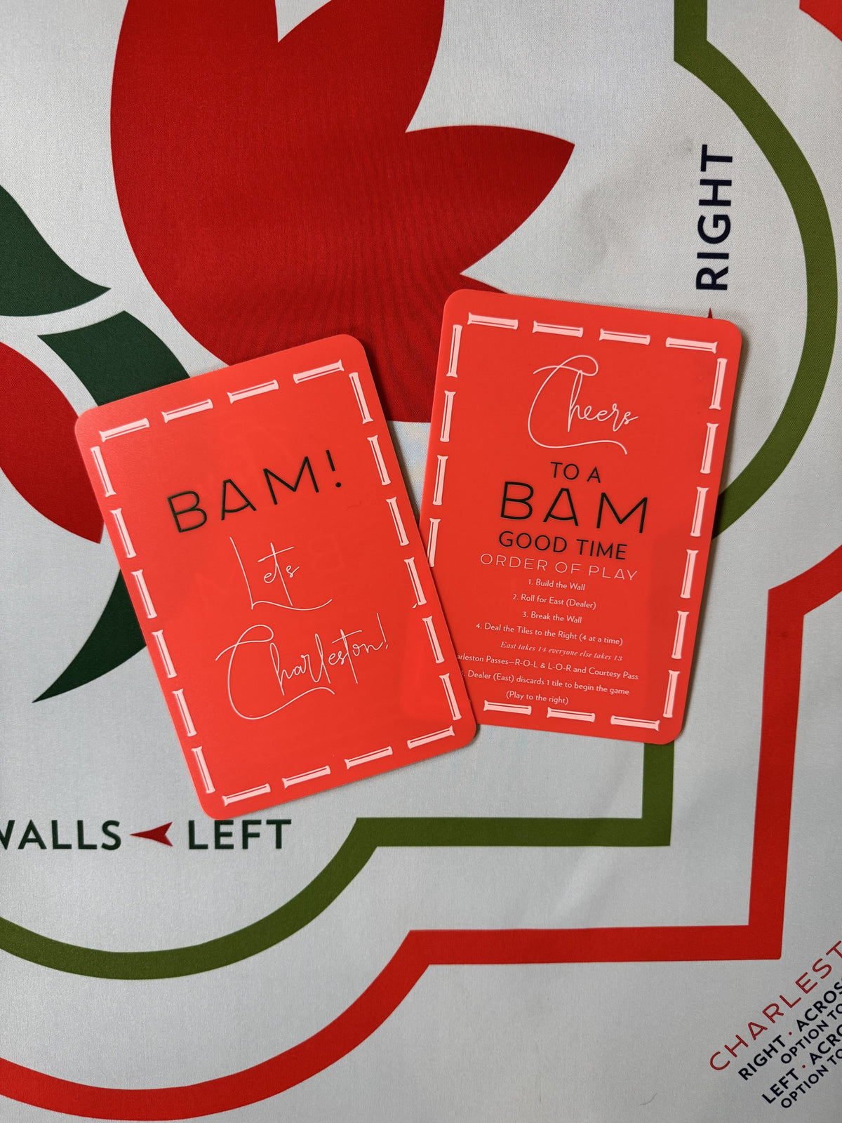 Red Bam Good Time mahjong shuffler cards, Order of Play and Charleston sides, shown on a Merry & Bright mat